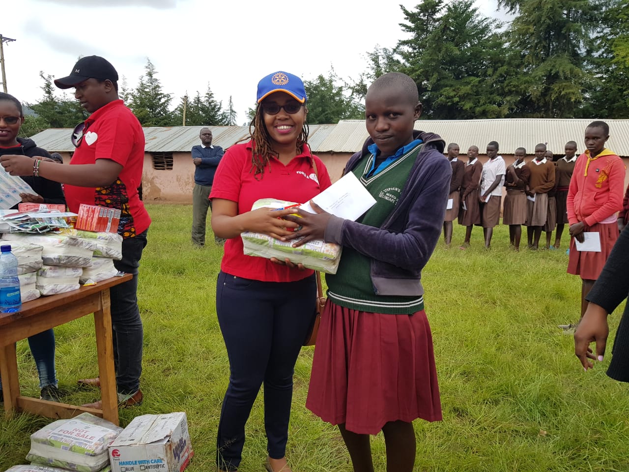 Why do girls need sanitary pads to stay in school?