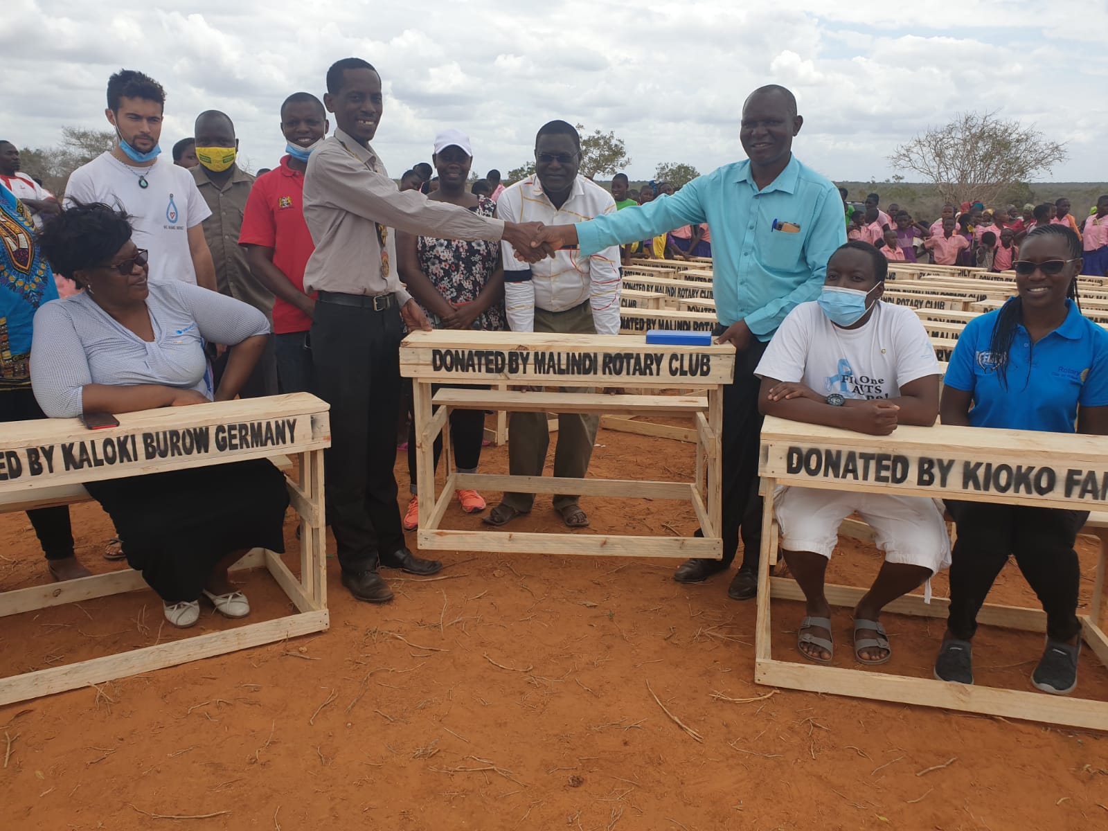 RC Malindi hand over desks to Kathama school headmaster